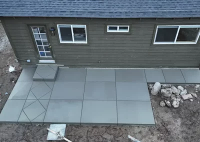 small concrete patio with decorative control joints