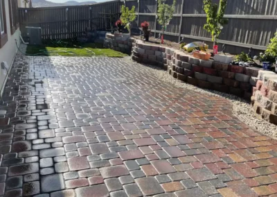 interlocking paver patio and block retaining wall