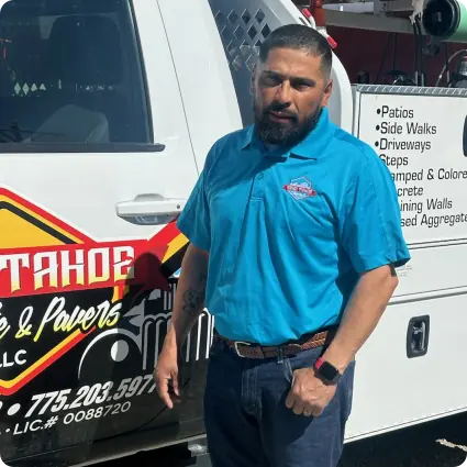 Owner, Jose Ramos standing in front of the company pick up truck